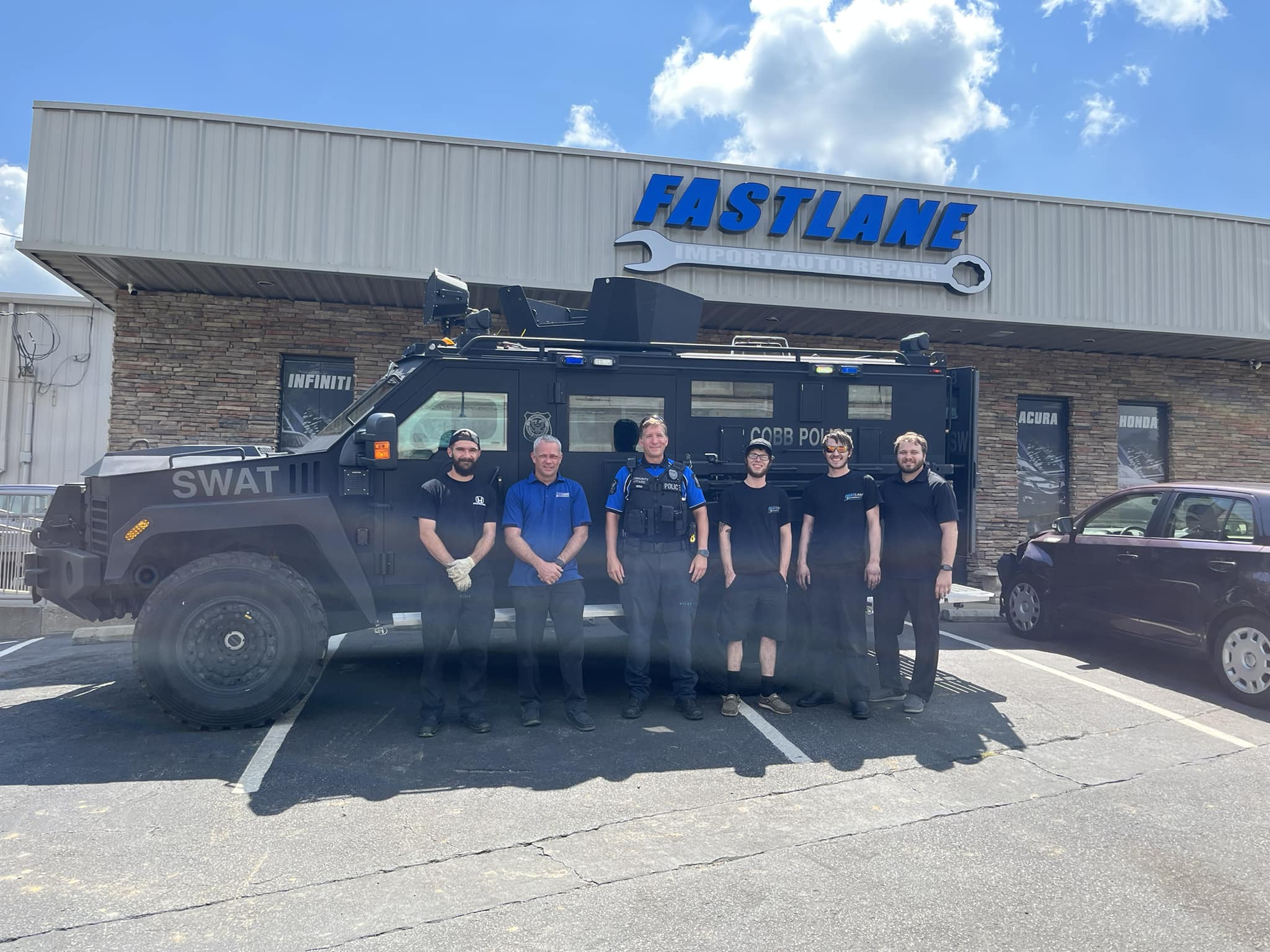 Fastlane Import Auto Repair Woodstock team outside the shop